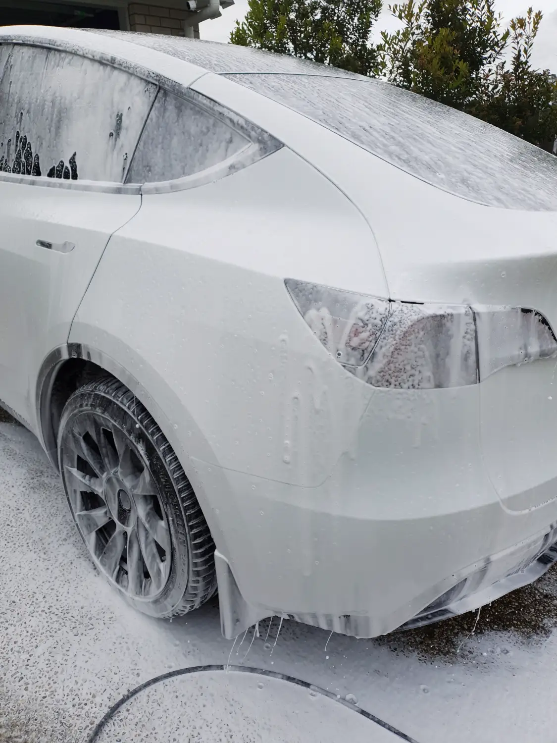 White car covered in soap | Featured image for the Jindalee car detailing location page