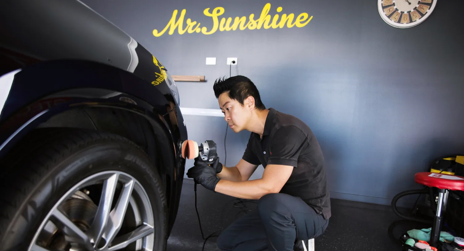 Jason Kim working on a car | Featured image for the full car detail blog.